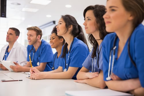 Medical students listening sitting at desk at the university